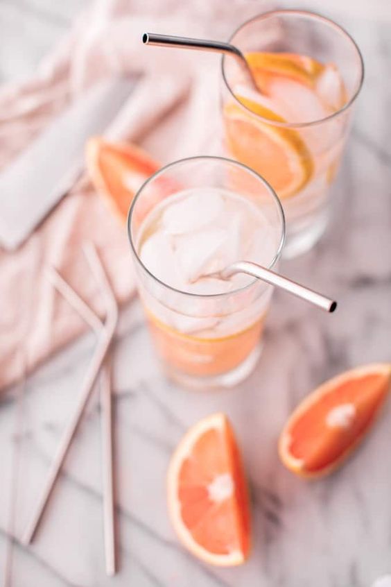 Gin and Pink Grapefruit drink with metal straw