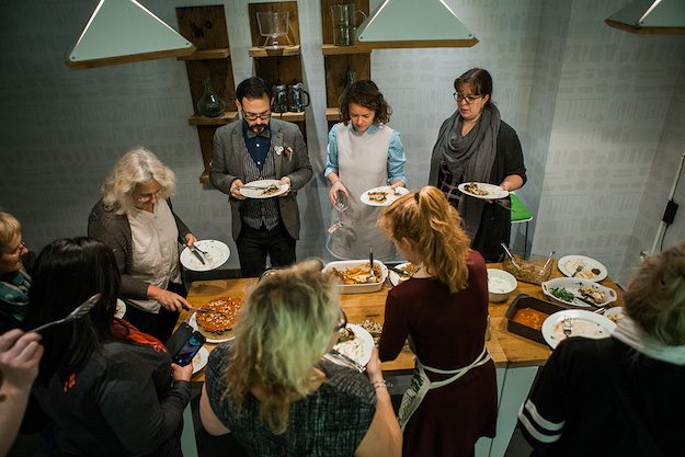 group of people eating at borough market cookbook club