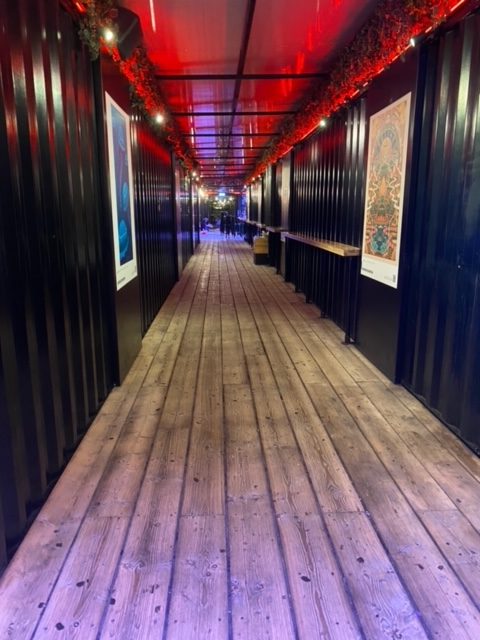 Long corridor leading to madre beer themed bar at hel's alcohol activation