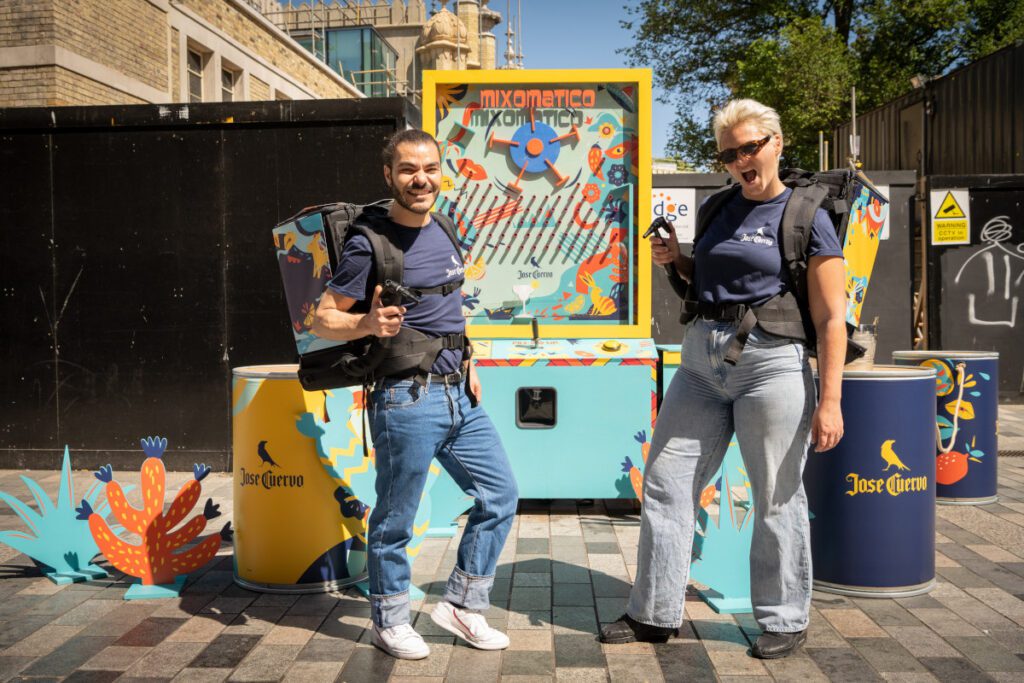 work colleagues with back pack drinks dispensers