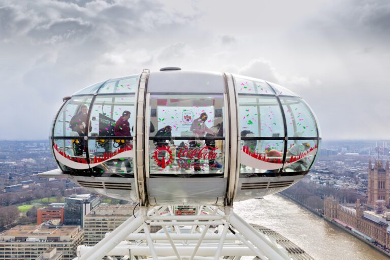 One of the pods on the London Eye with people inside chasing glittery paper