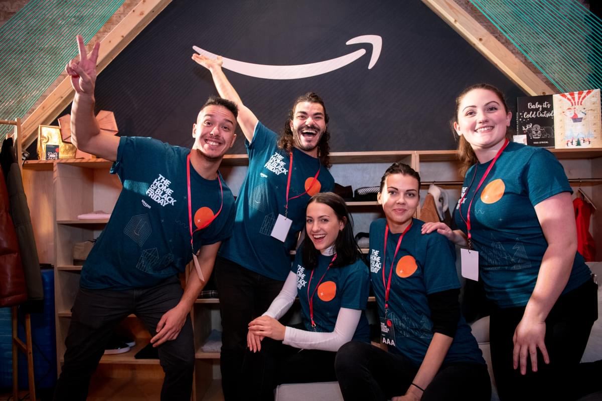 work colleagues dressed in blue tee shirts at an Amazon job